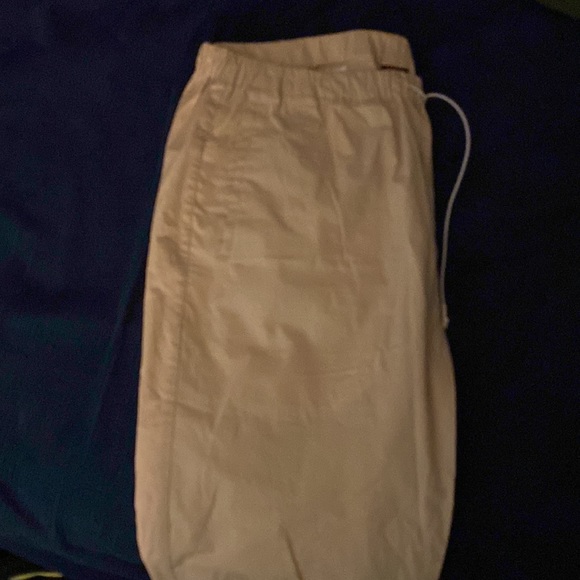 Large semi stretchy khaki pants. Beige type colour. Very stylish to go with fits - Picture 4 of 5